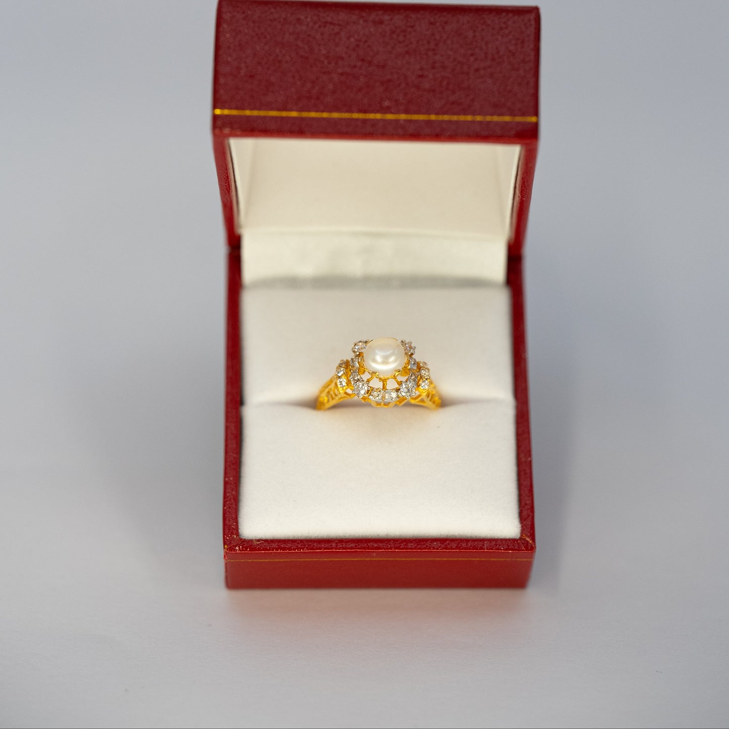 Gold ring with pearl setting
