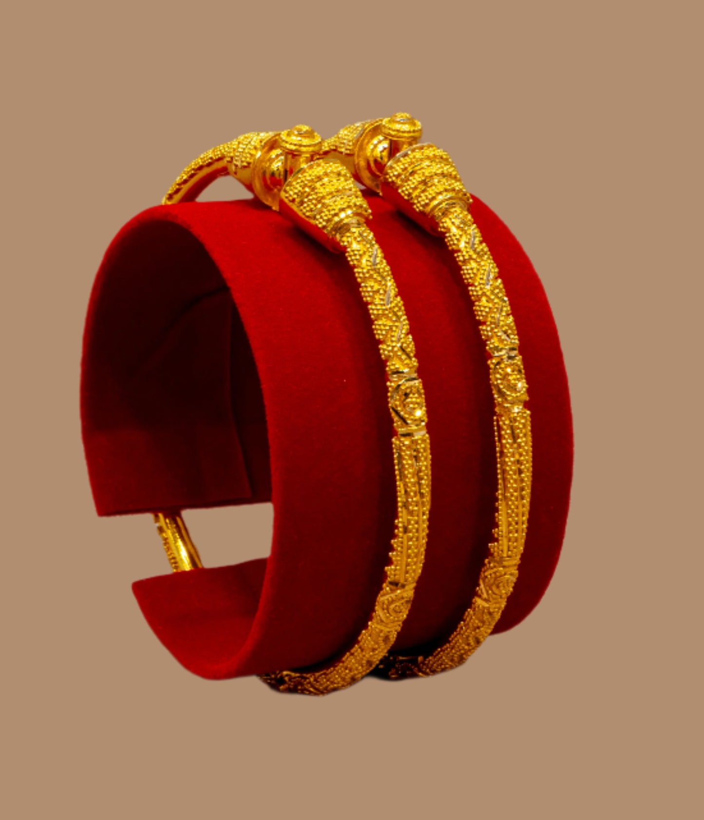 Red and gold bracelet on a textured surface