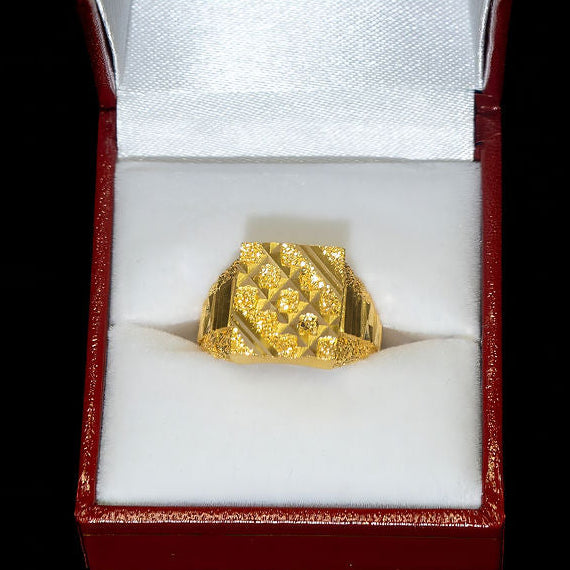 Gold ring in a red box on a black background
