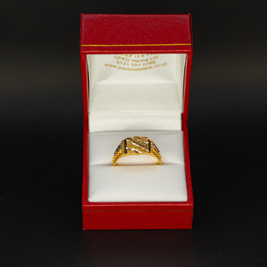 Gold ring in a red box on a black background