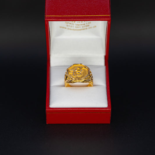 Gold ring in a red box on a black background