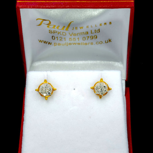 Diamond earrings in a Paul Jewellers box on a black background