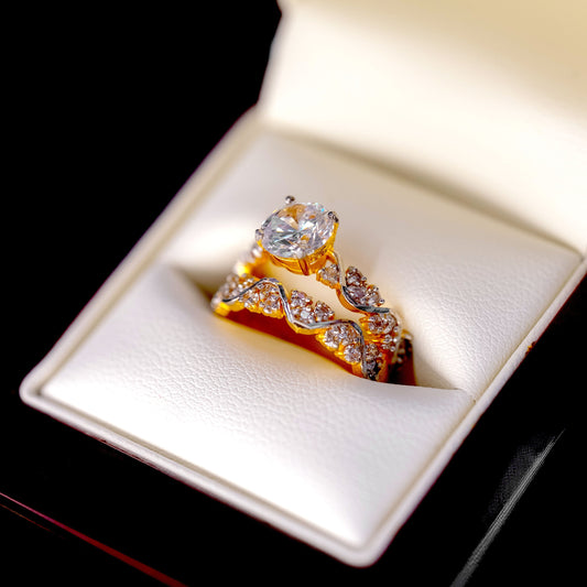 Gold ring with diamonds in a jewelry box on a black background
