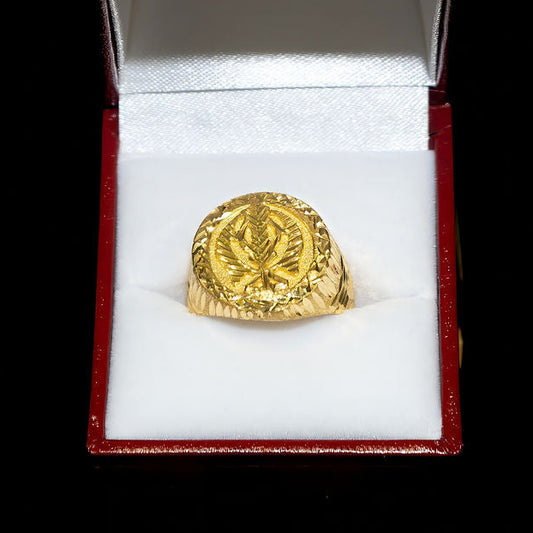Gold ring in a red jewelry box on a black background